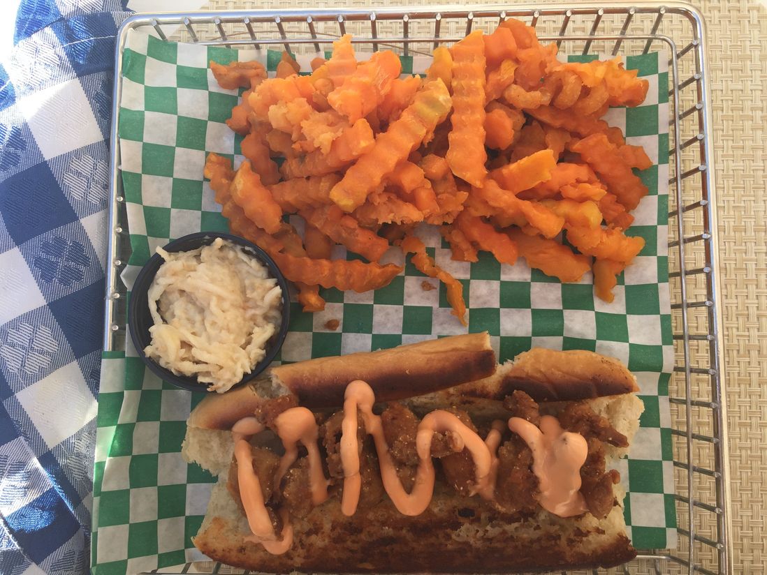 A shrimp roll and sweet potato fries eaten beachside at Sandals<br/>